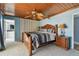 Main bedroom with wood ceiling, king bed and ensuite bathroom at 2970 68Th S Ave, St Petersburg, FL 33712