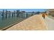 A view of the waterfront and boat dock from the beige paver patio outside the property at 2970 68Th S Ave, St Petersburg, FL 33712
