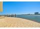 Expansive waterfront patio with textured pavers and stunning ocean views with pier at 2970 68Th S Ave, St Petersburg, FL 33712