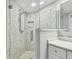 Updated shower with decorative gray tile and glass door at 2970 68Th S Ave, St Petersburg, FL 33712