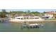 Waterfront home featuring a private dock and boat lift offering convenient access to the open water at 2970 68Th S Ave, St Petersburg, FL 33712