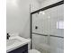 Modern bathroom featuring a glass-enclosed shower and sleek vanity at 31651 Westbury Estates Ave, Wesley Chapel, FL 33545