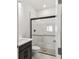 Modern bathroom featuring a glass-enclosed shower and sleek vanity at 31651 Westbury Estates Ave, Wesley Chapel, FL 33545