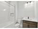 Bright bathroom featuring a shower-tub combination and a sleek modern vanity at 31651 Westbury Estates Ave, Wesley Chapel, FL 33545