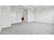 Bright bedroom with plush carpet and access to the ensuite bathroom providing comfort and privacy at 31651 Westbury Estates Ave, Wesley Chapel, FL 33545