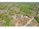 Aerial view of a property with house icon, highlighting its location within a lush, green neighborhood at 33357 Westwood Dr, Ridge Manor, FL 33523