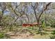 Charming home nestled among mature trees offers privacy and a serene natural setting at 33357 Westwood Dr, Ridge Manor, FL 33523
