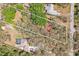 Large lot with mature trees featuring an in-ground pool, fenced yard, and ample parking at 33357 Westwood Dr, Ridge Manor, FL 33523