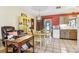 Dining area with tiled floor, access to the outside and adjacent to a desk area at 33357 Westwood Dr, Ridge Manor, FL 33523
