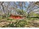 Charming single-story home nestled amidst mature trees and lush greenery at 33357 Westwood Dr, Ridge Manor, FL 33523