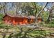 Attractive single-story home featuring a one-car garage and mature landscaping at 33357 Westwood Dr, Ridge Manor, FL 33523
