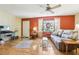 Bright living room with hardwood floors, a large window, and comfortable seating at 33357 Westwood Dr, Ridge Manor, FL 33523