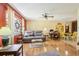 Open-concept living area with hardwood floors and dining space at 33357 Westwood Dr, Ridge Manor, FL 33523