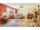 Cozy living area with a ceiling fan, hardwood floors, and lots of light at 33357 Westwood Dr, Ridge Manor, FL 33523