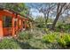 Inviting porch with decorative accents and lush tropical landscaping at 33357 Westwood Dr, Ridge Manor, FL 33523