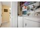Functional laundry room with washer, dryer, and ample storage space, offering convenience for household chores at 3610 Magnolia Ridge Cir # 1322/H, Palm Harbor, FL 34684