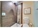 Updated bathroom featuring a modern shower with elegant tile work and a glass enclosure at 367 Bobby Jones Rd # 367, Sarasota, FL 34232