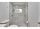 Clean bathroom showcases a frameless glass shower with marble-like tiles, enhancing the space with a fresh and modern look at 367 Bobby Jones Rd # 367, Sarasota, FL 34232