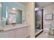 Bright bathroom featuring a modern vanity and sleek glass enclosed shower at 367 Bobby Jones Rd # 367, Sarasota, FL 34232