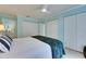 Bright bedroom with a ceiling fan, light blue walls, and a large closet at 367 Bobby Jones Rd # 367, Sarasota, FL 34232