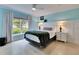 Inviting bedroom features a large window with natural light, complemented by stylish decor and a tranquil ambiance at 367 Bobby Jones Rd # 367, Sarasota, FL 34232