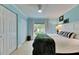 Bright bedroom features a large window with natural light, complemented by stylish decor and ample storage at 367 Bobby Jones Rd # 367, Sarasota, FL 34232