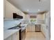 Bright kitchen features white cabinets, stainless steel appliances, and ample counter space at 367 Bobby Jones Rd # 367, Sarasota, FL 34232