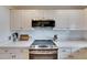 Modern kitchen features stainless steel appliances, white countertops, and cabinetry at 367 Bobby Jones Rd # 367, Sarasota, FL 34232