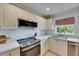 Modern kitchen features stainless steel appliances, countertops, and white cabinetry at 367 Bobby Jones Rd # 367, Sarasota, FL 34232