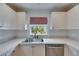 Kitchen with white cabinets, quartz countertops, tiled backsplash, and stainless steel appliances at 367 Bobby Jones Rd # 367, Sarasota, FL 34232