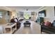 Bright living room featuring built-in shelves, a bay window, and comfortable seating at 367 Bobby Jones Rd # 367, Sarasota, FL 34232