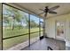 Relaxing screened patio with a view of the backyard at 367 Bobby Jones Rd # 367, Sarasota, FL 34232
