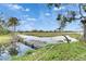 Scenic view of the community pond, landscaping, and golf course, perfect for relaxing outdoors at 367 Bobby Jones Rd # 367, Sarasota, FL 34232
