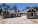 Charming single-story home with a paver driveway, two-car garage, and well-manicured front yard at 4787 Majestic Hills Loop, Brooksville, FL 34601