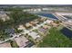 An aerial view captures a neighborhood with beautiful homes near lakes and trees at 5409 Conch Shell Pl, Apollo Beach, FL 33572