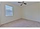 Neutral bedroom with carpet flooring, a window with blinds, ceiling fan, and electrical outlets throughout at 5409 Conch Shell Pl, Apollo Beach, FL 33572