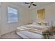 Staged bedroom featuring contemporary decor, neutral carpet, and large bright window at 5409 Conch Shell Pl, Apollo Beach, FL 33572