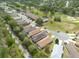 An aerial view shows the neighborhood's layout and proximity to a golf course and green spaces at 5664 Legend Hills Ln, Spring Hill, FL 34609