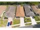 An aerial view captures the neighborhood homes and their well-maintained yards and landscaping at 5664 Legend Hills Ln, Spring Hill, FL 34609