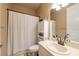 Neutral bathroom with a framed mirror, a white vanity, and a shower at 5664 Legend Hills Ln, Spring Hill, FL 34609