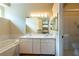 Elegant bathroom with double sinks, a tub, and a separate shower, providing a spa-like experience at 5664 Legend Hills Ln, Spring Hill, FL 34609