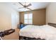 Bedroom with neutral colors, a ceiling fan and an adjacent closet at 5664 Legend Hills Ln, Spring Hill, FL 34609
