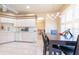 Open kitchen and dining area with a view of the hallway for easy access at 5664 Legend Hills Ln, Spring Hill, FL 34609