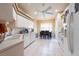 Bright kitchen with stainless appliances, tile flooring, and a cozy dining area by the window at 5664 Legend Hills Ln, Spring Hill, FL 34609