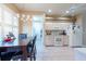 Well-lit kitchen featuring modern appliances, dining area, and tile flooring for easy maintenance at 5664 Legend Hills Ln, Spring Hill, FL 34609