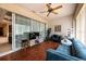 Inviting living room featuring modern furnishings, a ceiling fan, and natural light from sliding glass doors at 5664 Legend Hills Ln, Spring Hill, FL 34609