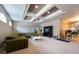 Spacious living area with tray ceiling, modern ceiling fan, and neutral carpet at 5664 Legend Hills Ln, Spring Hill, FL 34609