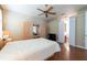 Serene bedroom featuring storage, hardwood floors, and modern fixtures at 5664 Legend Hills Ln, Spring Hill, FL 34609