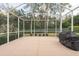 Wide screened-in patio for comfortable outdoor living at 5664 Legend Hills Ln, Spring Hill, FL 34609