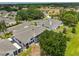 Aerial view of home showcasing mature trees and lush landscaping at 604 Mcdaniel St, Sun City Center, FL 33573